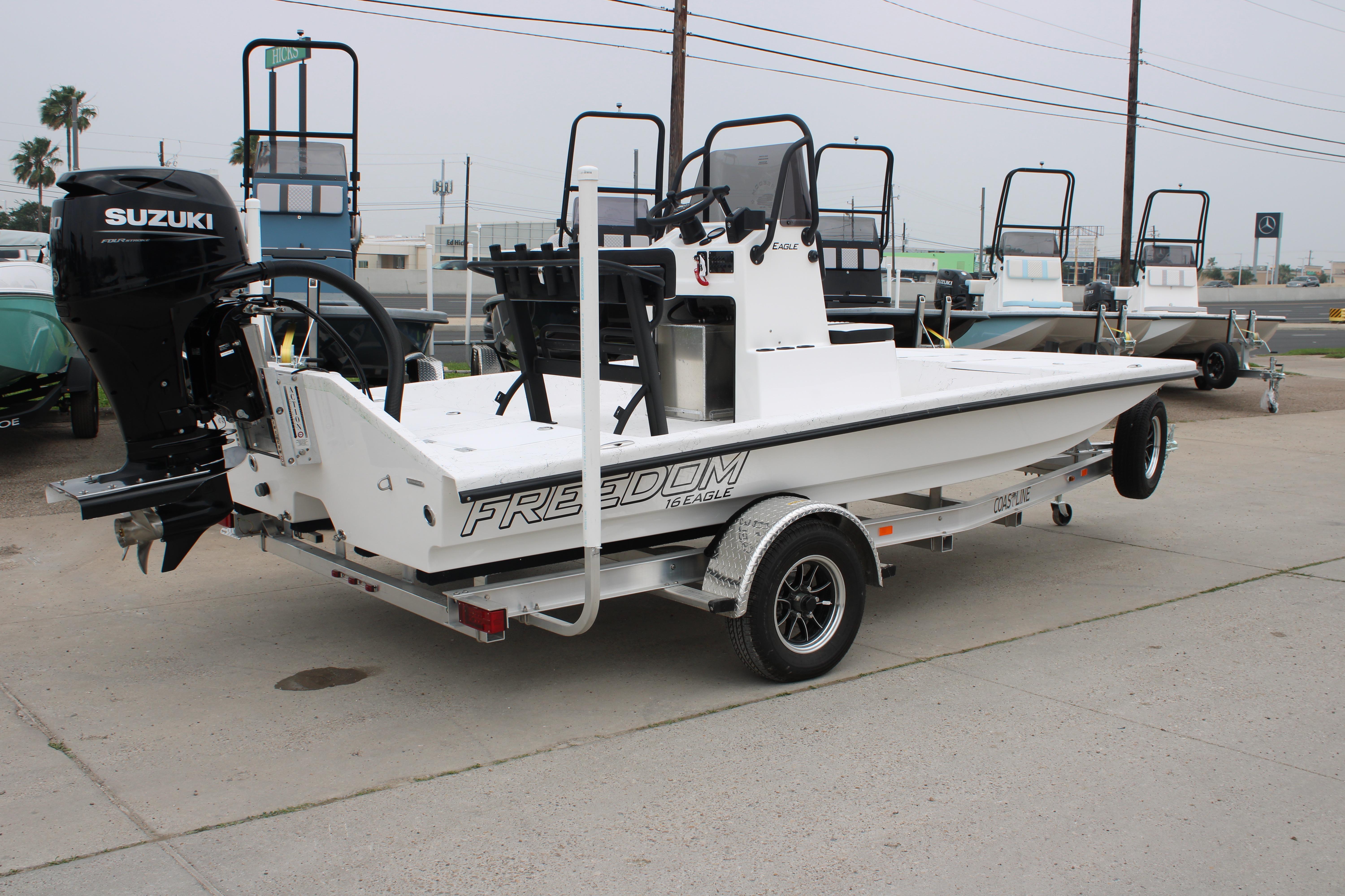 2026 Freedom Boats 16' Eagle on trailer with Suzuki outboard motor.