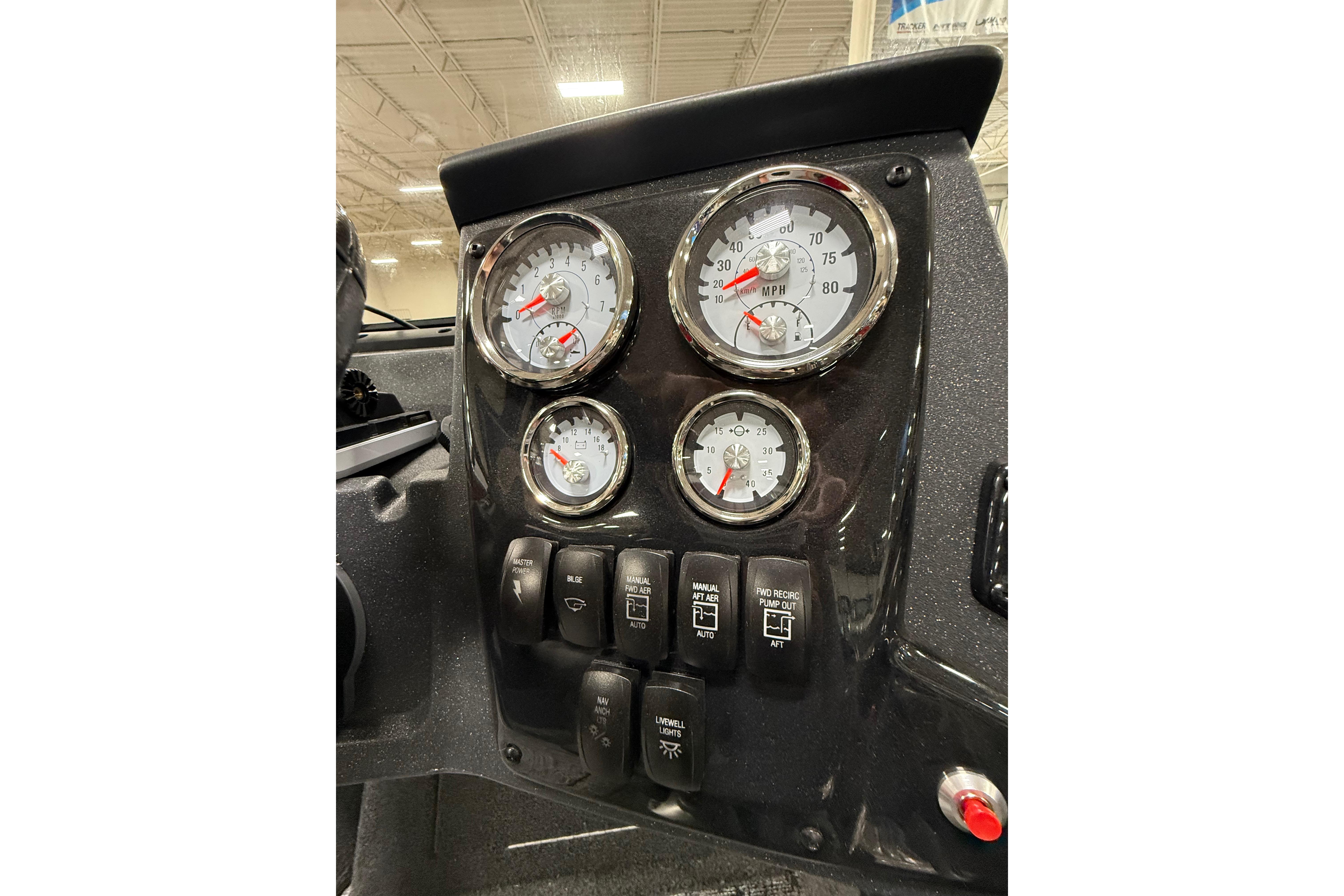 Dashboard of 2026 Tracker Targa V-19 WT boat with gauges and switches.