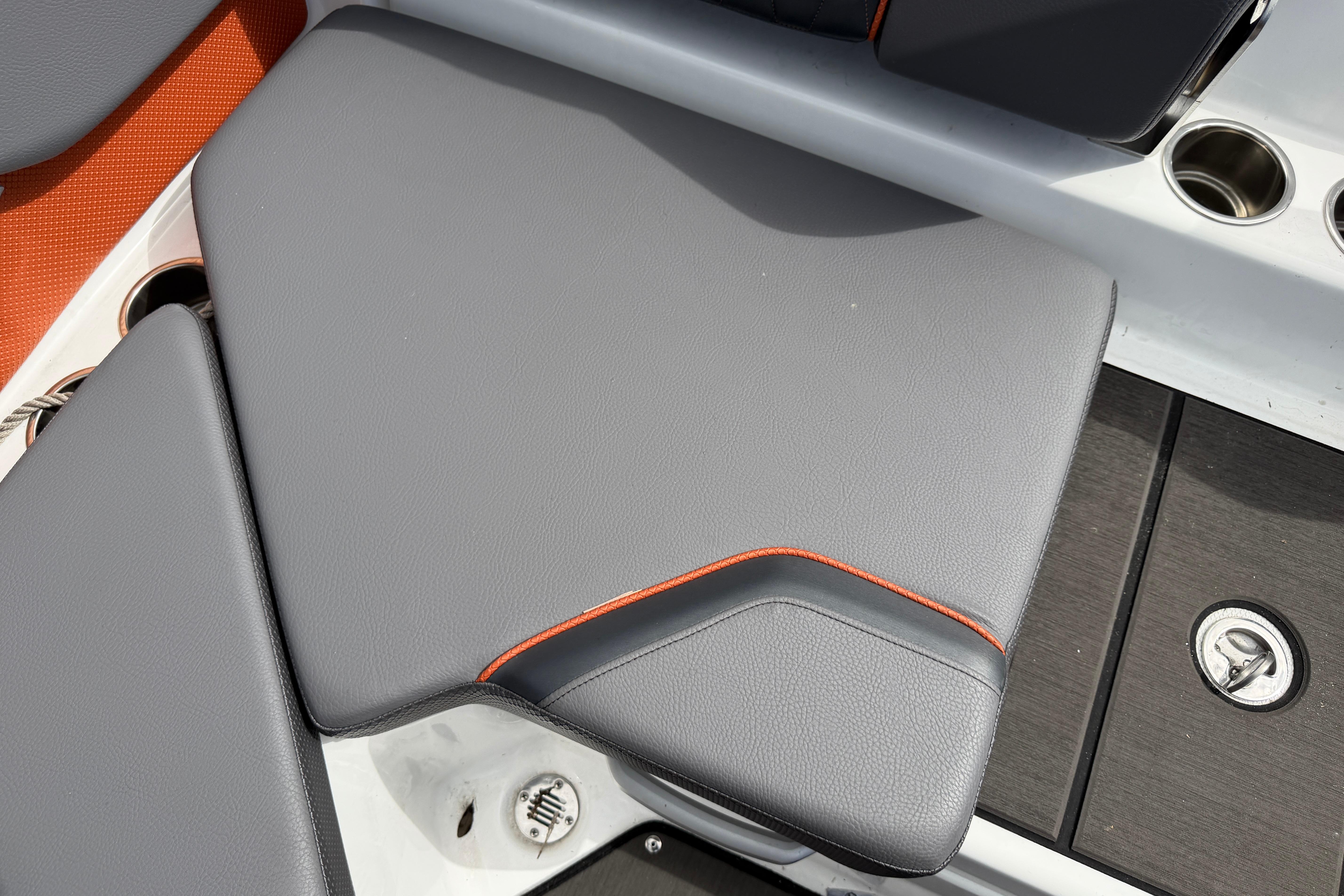 2026 Scarab 235 LX boat seat with gray upholstery and orange accents.