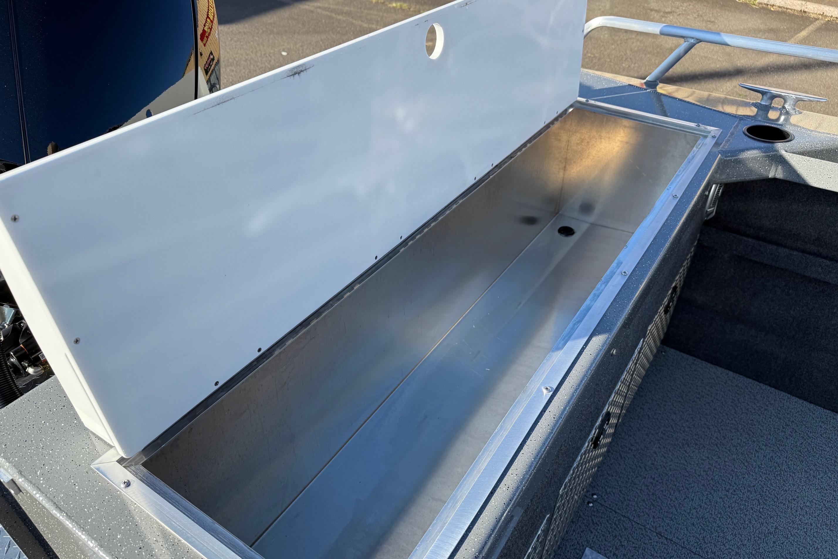 Open storage compartment in 2026 Thunder Jet 200 Luxor boat, showcasing spacious interior.