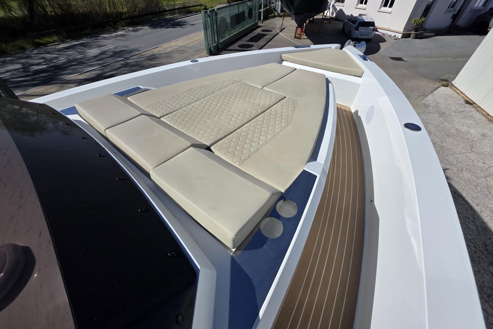 2024 De Antonio Yachts D36 OPEN with beige cushioned deck seating.