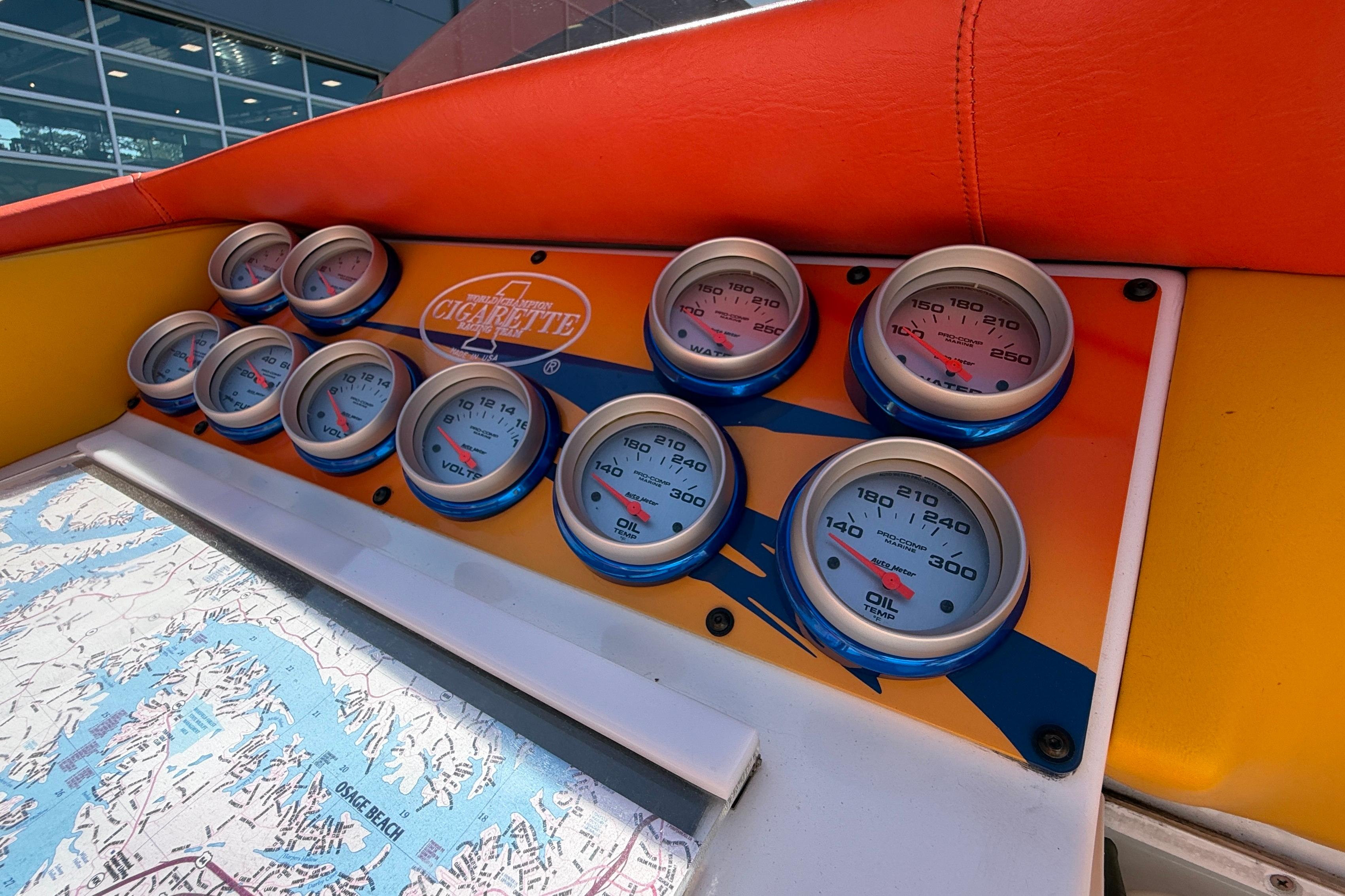 Dashboard of a 2002 Cigarette 35' Cafe Racer with gauges and map detail.