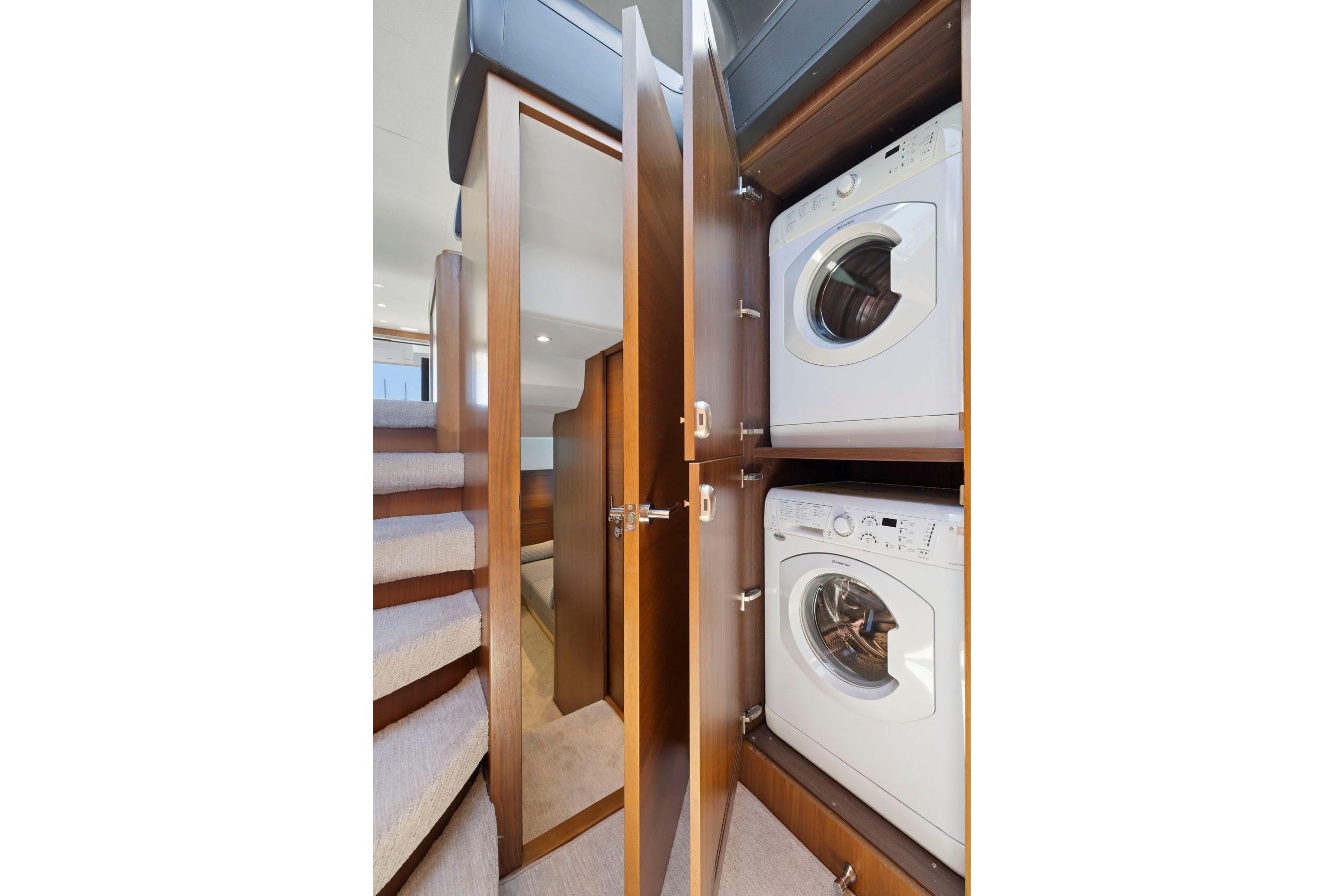 Laundry area with washer and dryer on 2015 Princess 60 Flybridge Motor Yacht.