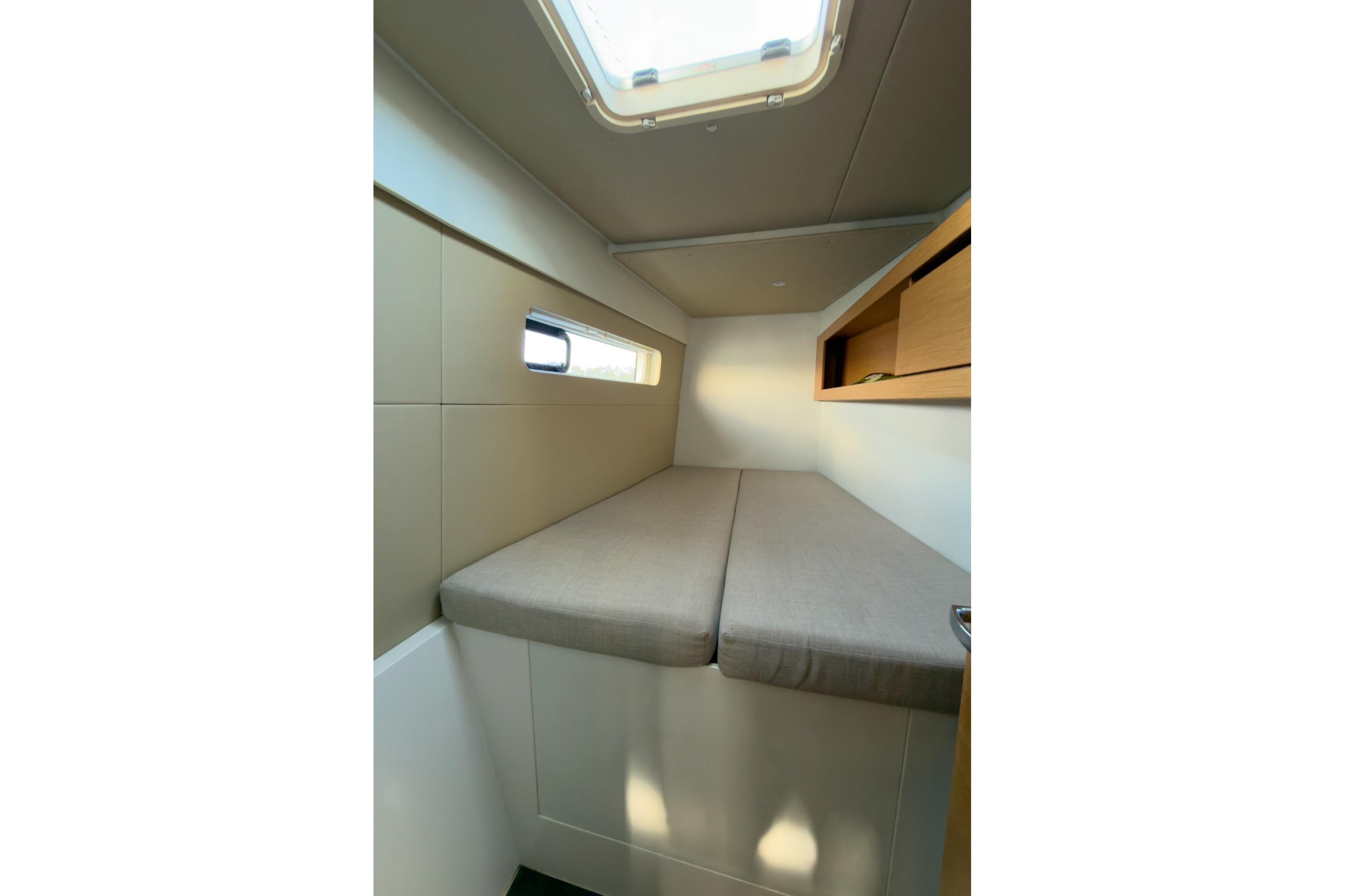 Cabin interior of 2015 Nautitech 40 Open catamaran with bed and window.
