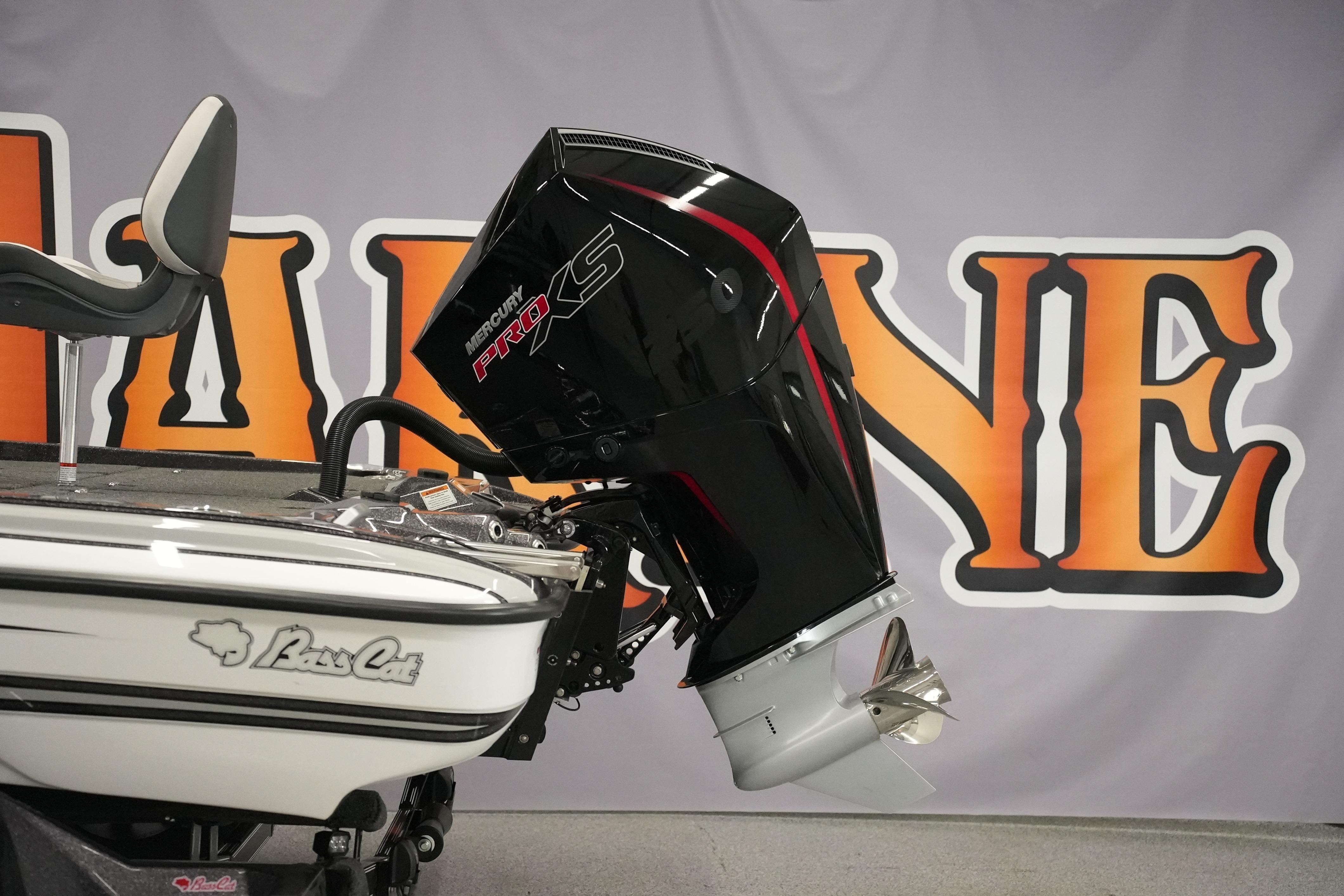 2026 Bass Cat Puma STS boat with Mercury Pro XS engine displayed indoors.