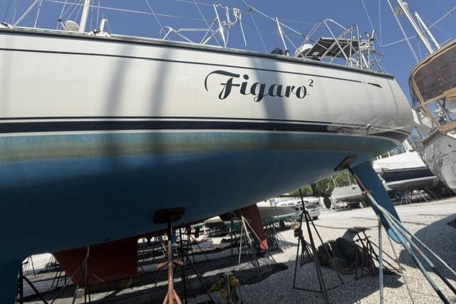 Saga 43 sailboat named Figaro² on stands, 2002 model, in a boatyard.