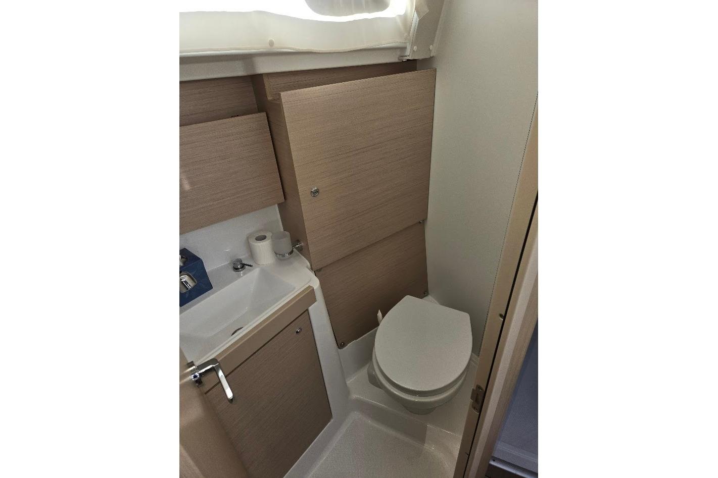 2023 Beneteau Oceanis 38.1 yacht bathroom with modern fixtures and compact design.