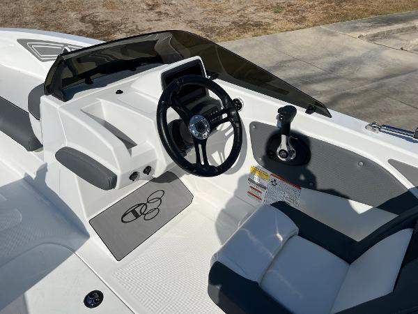 2024 Tahoe T21 boat cockpit with steering wheel and control panel.
