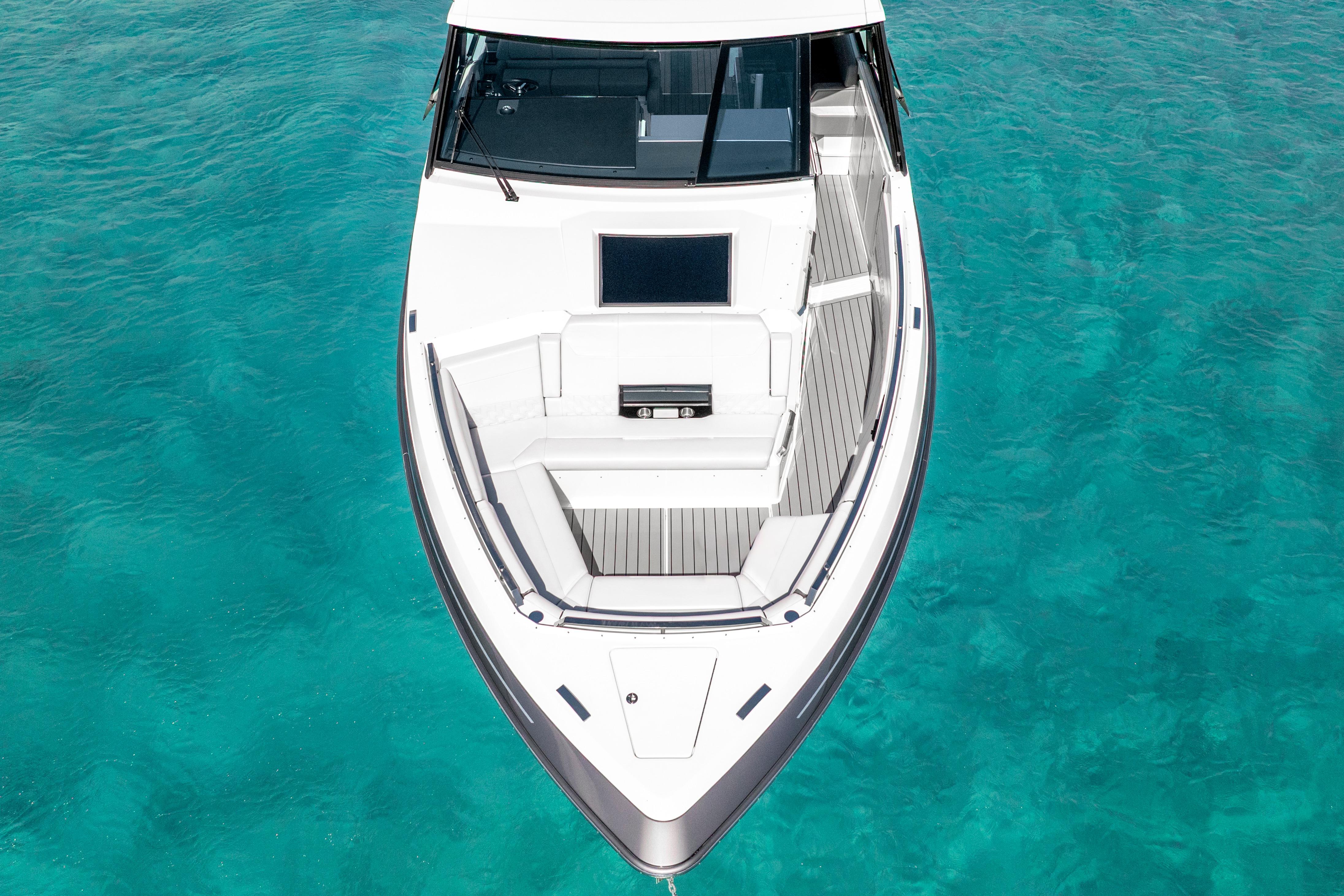 2022 Formula 500 Super Sport Crossover boat on clear turquoise water.