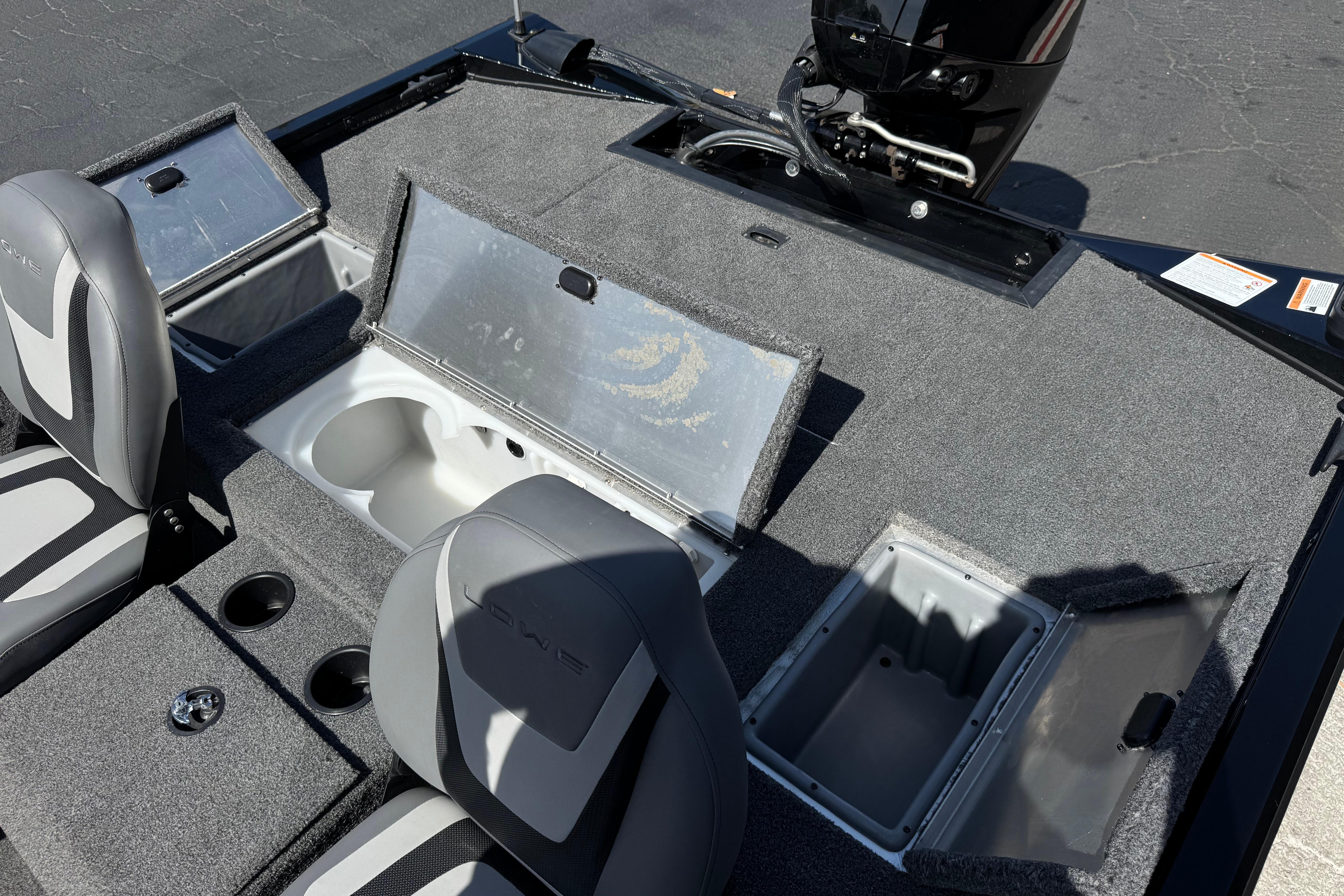 2024 Lowe Stinger 175 boat interior with open storage compartments and seating.