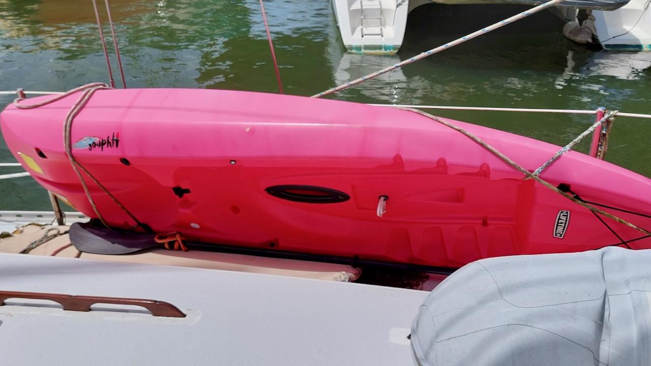 Pink kayak secured on 1981 Morgan Out Island 41 sailboat deck.