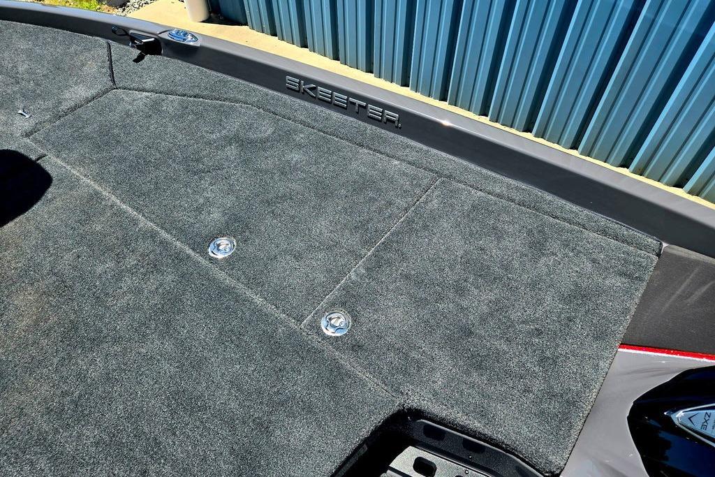 2026 Skeeter ZXE20 boat deck with gray carpet and storage compartments.