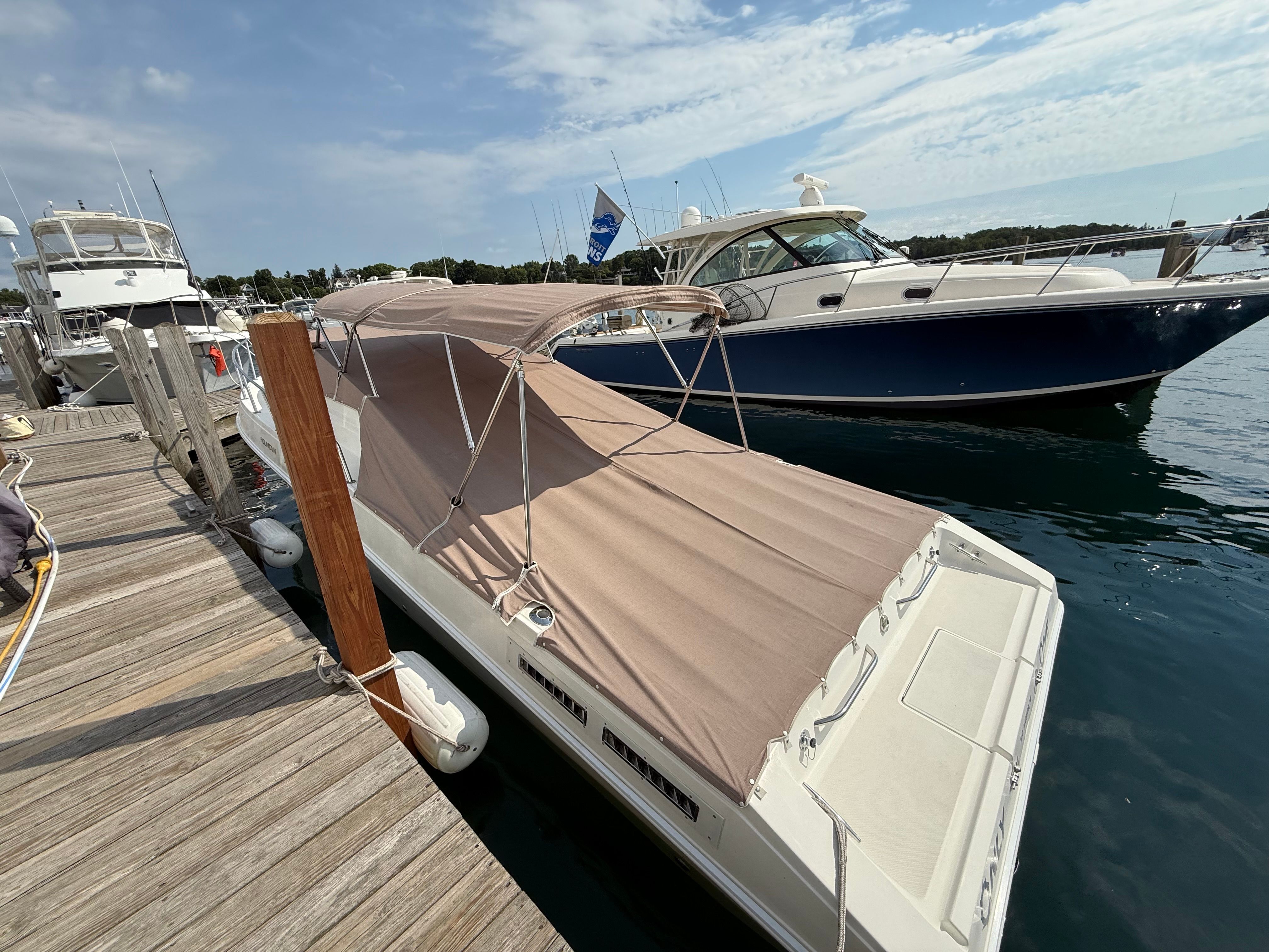 1999 Fountain 32 Sport Fish Cruiser at the dock.