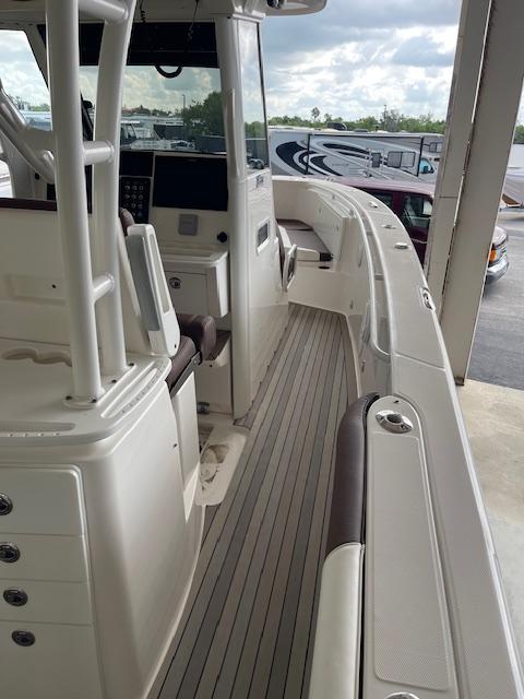 2014 Everglades 325 Center Console boat interior with helm and seating area.