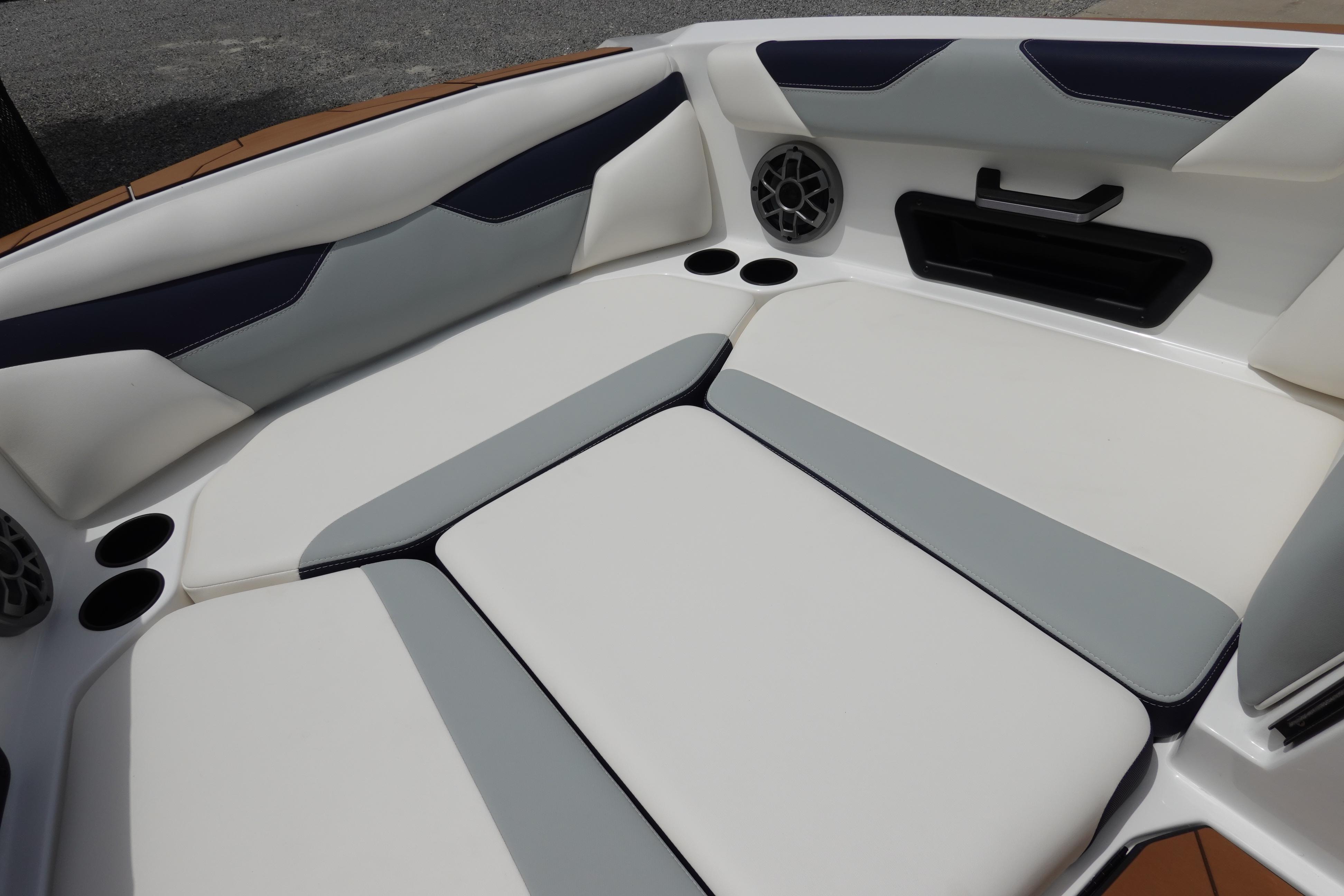 2023 Axis A24 boat interior with cushioned seating and built-in speakers.