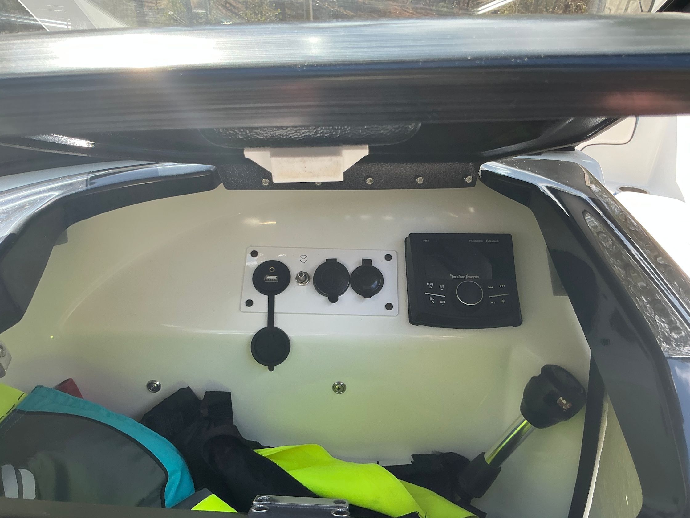 Interior view of a 2021 Scarab 215 ID boat with controls.