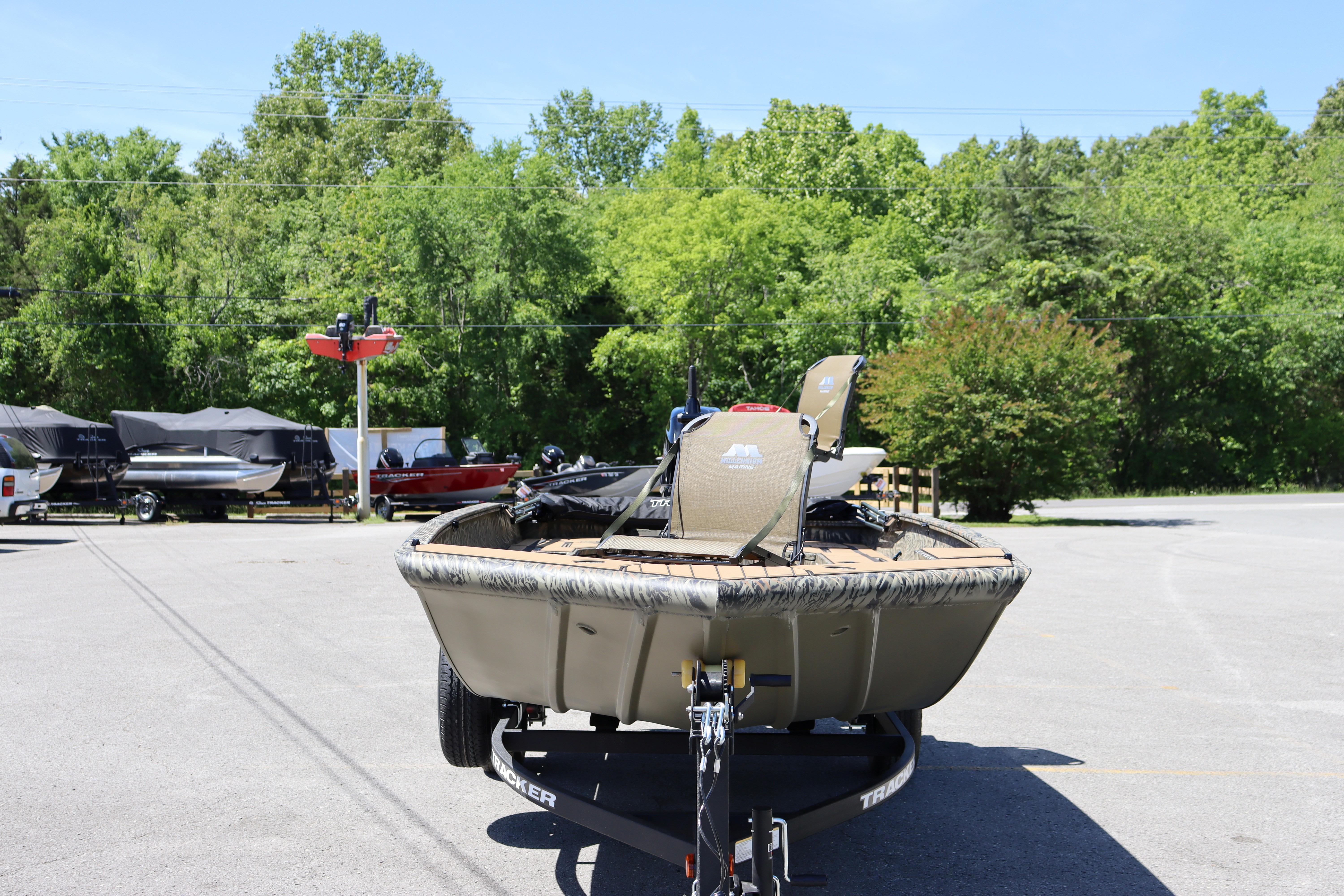 2026 Tracker Grizzly 1756 T Marsh boat on trailer in sunny outdoor setting.