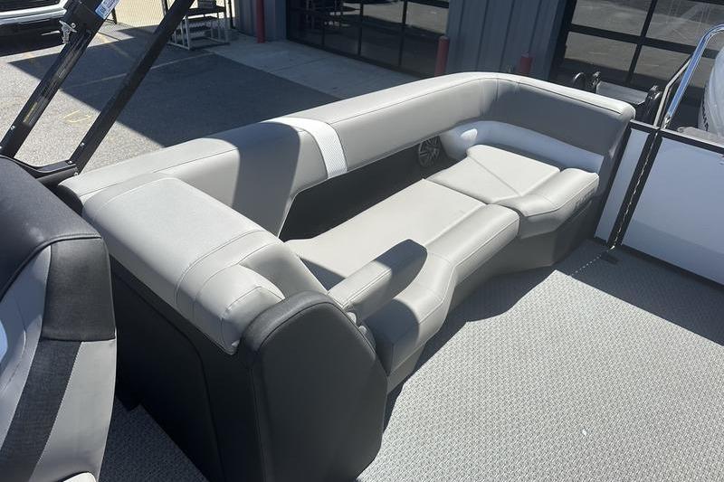Luxurious seating on 2026 Evotti 523QL boat, featuring sleek gray upholstery.
