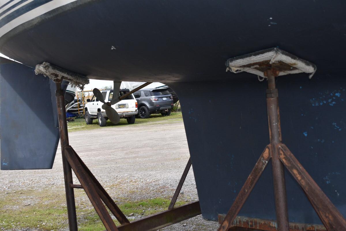 Underside of an S2 9.2A sailboat on stands.