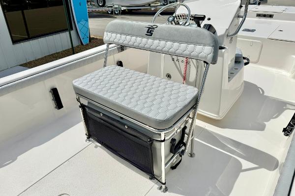 2025 Carolina Skiff 21 LS boat interior with cushioned seating and steering console.