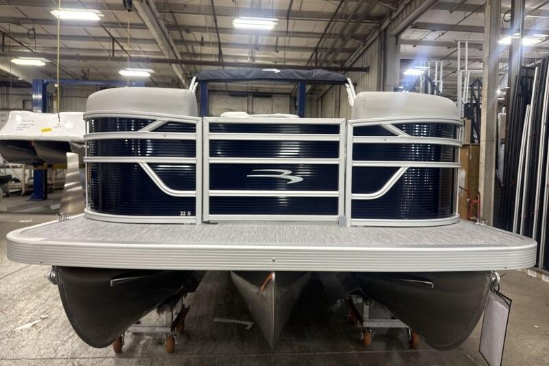 2026 Bennington 22 SSRSF pontoon boat in a warehouse setting.