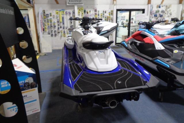 2025 Yamaha WaveRunner GP1800R SVHO in showroom, rear view, blue and white design.