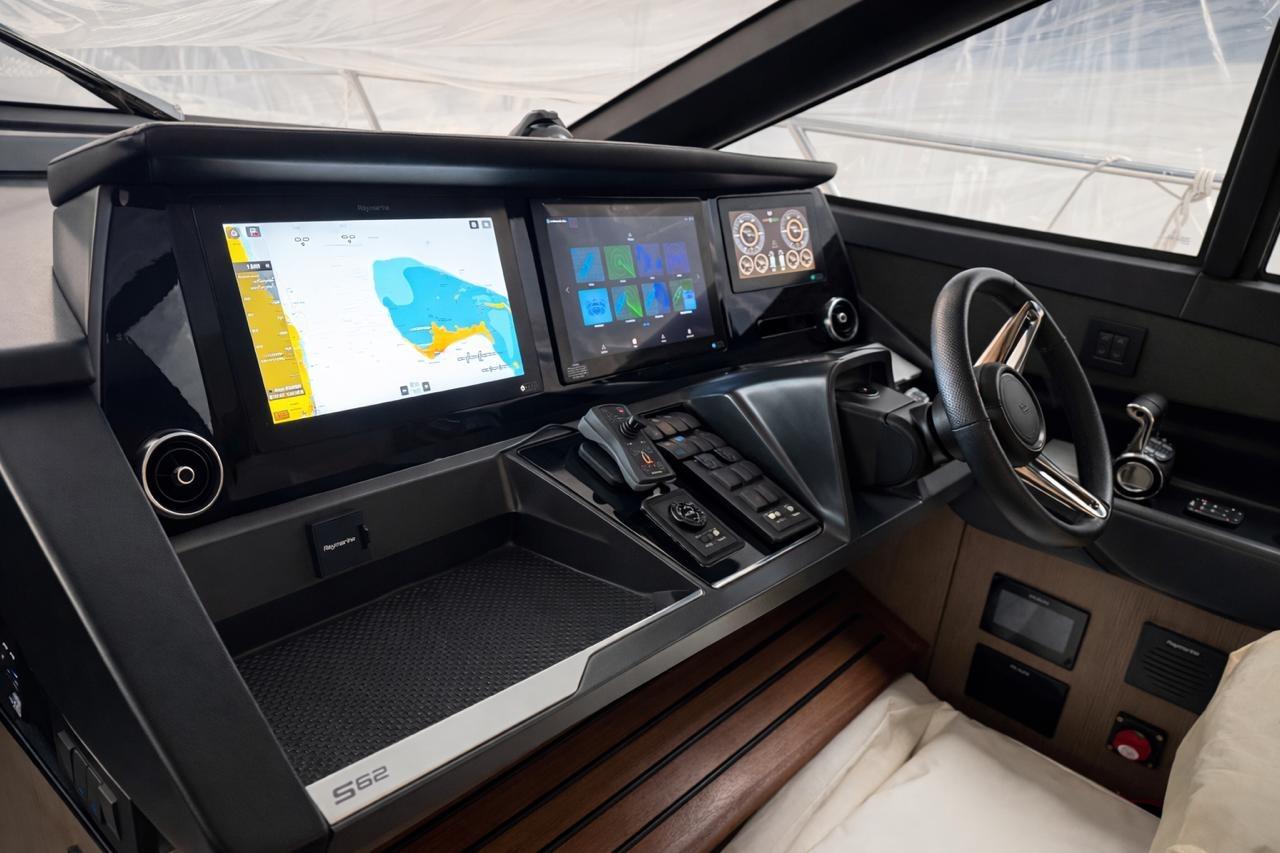 Helm of 2022 Princess S62 yacht with advanced navigation displays and controls.