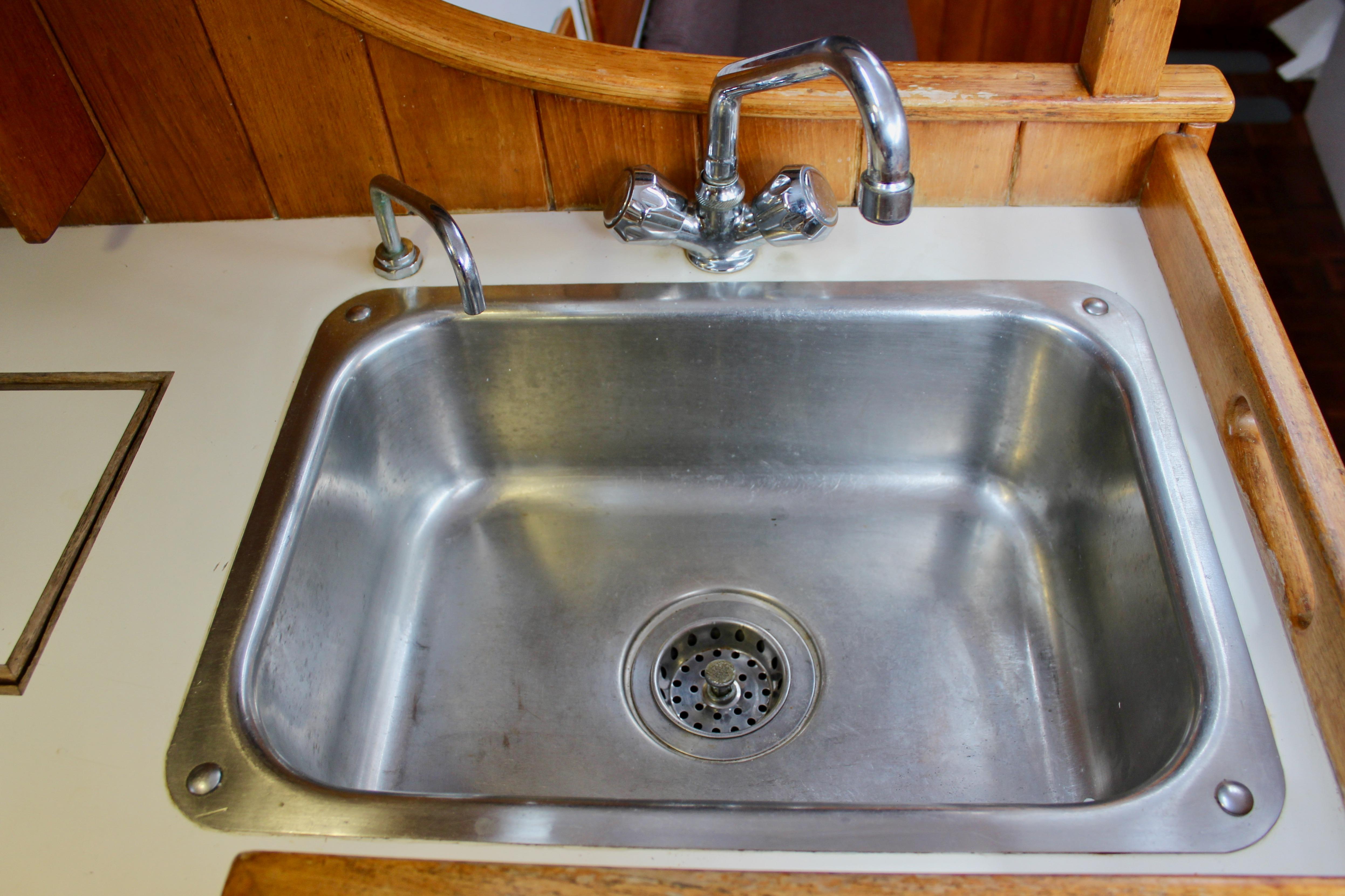 Stainless steel sink in 1975 William Garden Porpoise boat kitchen.