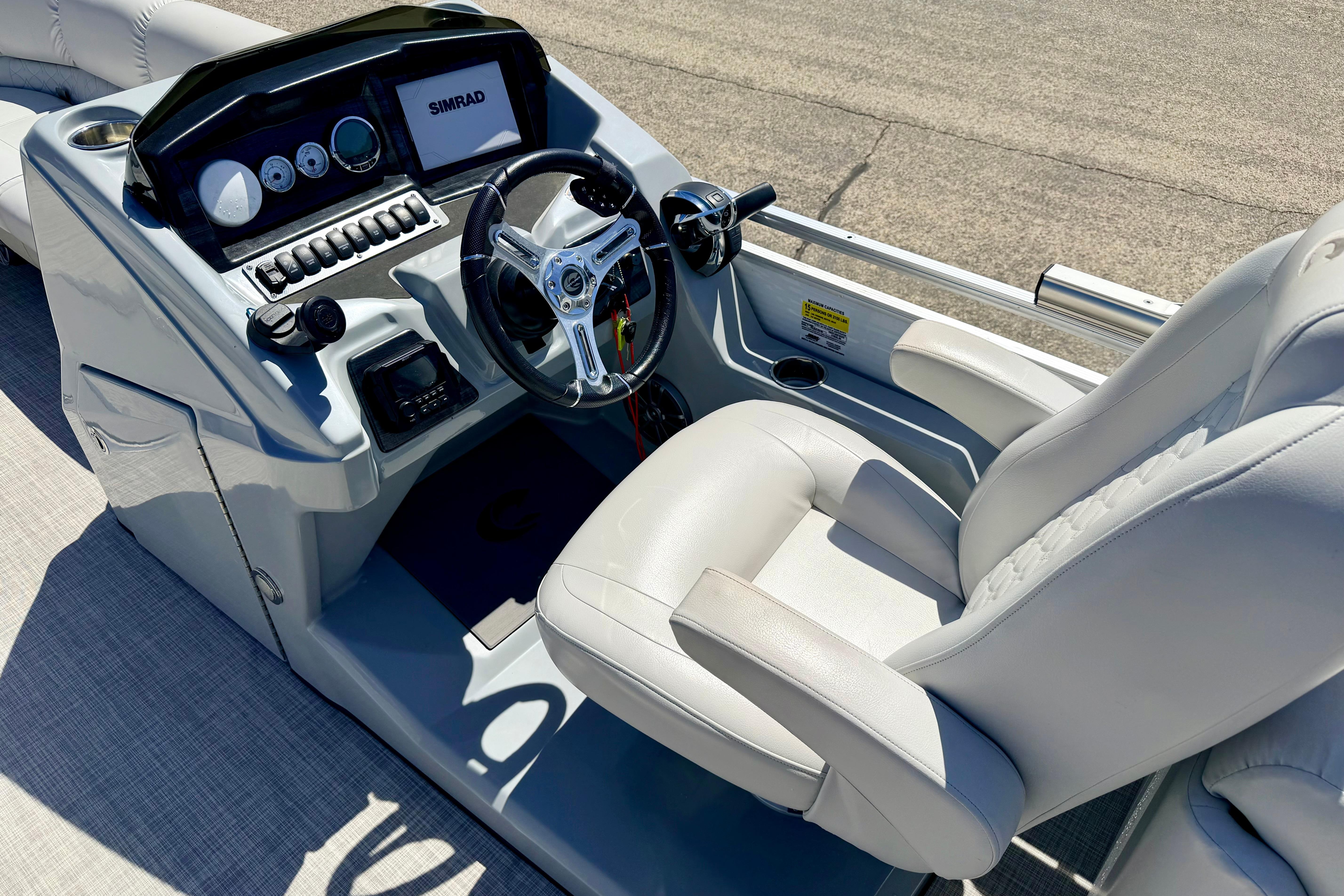 2019 Crestliner 240 Rally DX CW boat helm with steering wheel and control panel.