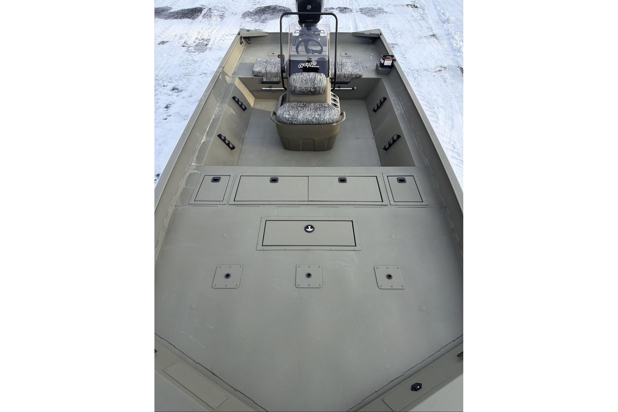 2026 Tracker Grizzly 2072 CC boat interior with spacious deck and seating.