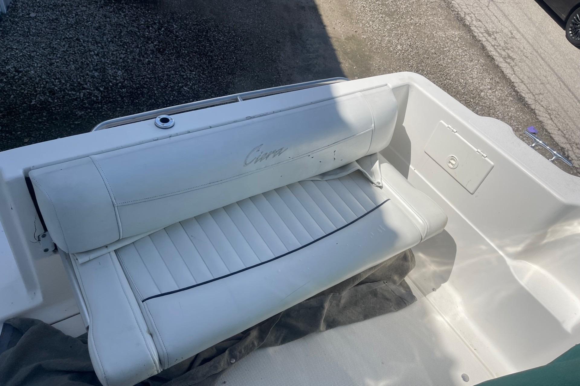 1997 Bayliner 2655 Ciera boat interior with white cushioned seating.