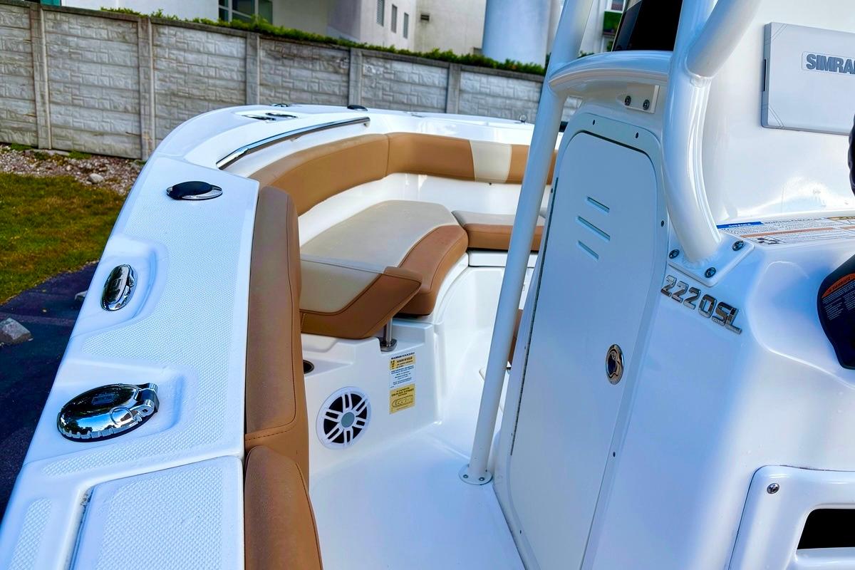 2024 NauticStar 222L Offshore boat interior with tan seating and white console.
