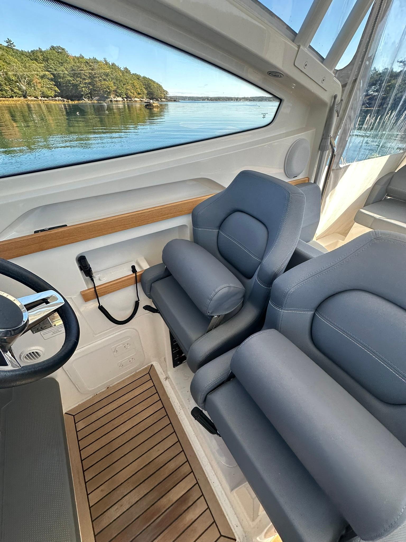 2021 Nimbus W9 boat interior with plush seating and scenic water view.
