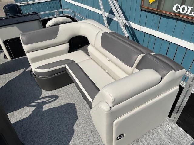 2026 Sun Tracker Fishin' Barge 20 DLX interior seating, featuring gray and white upholstery.