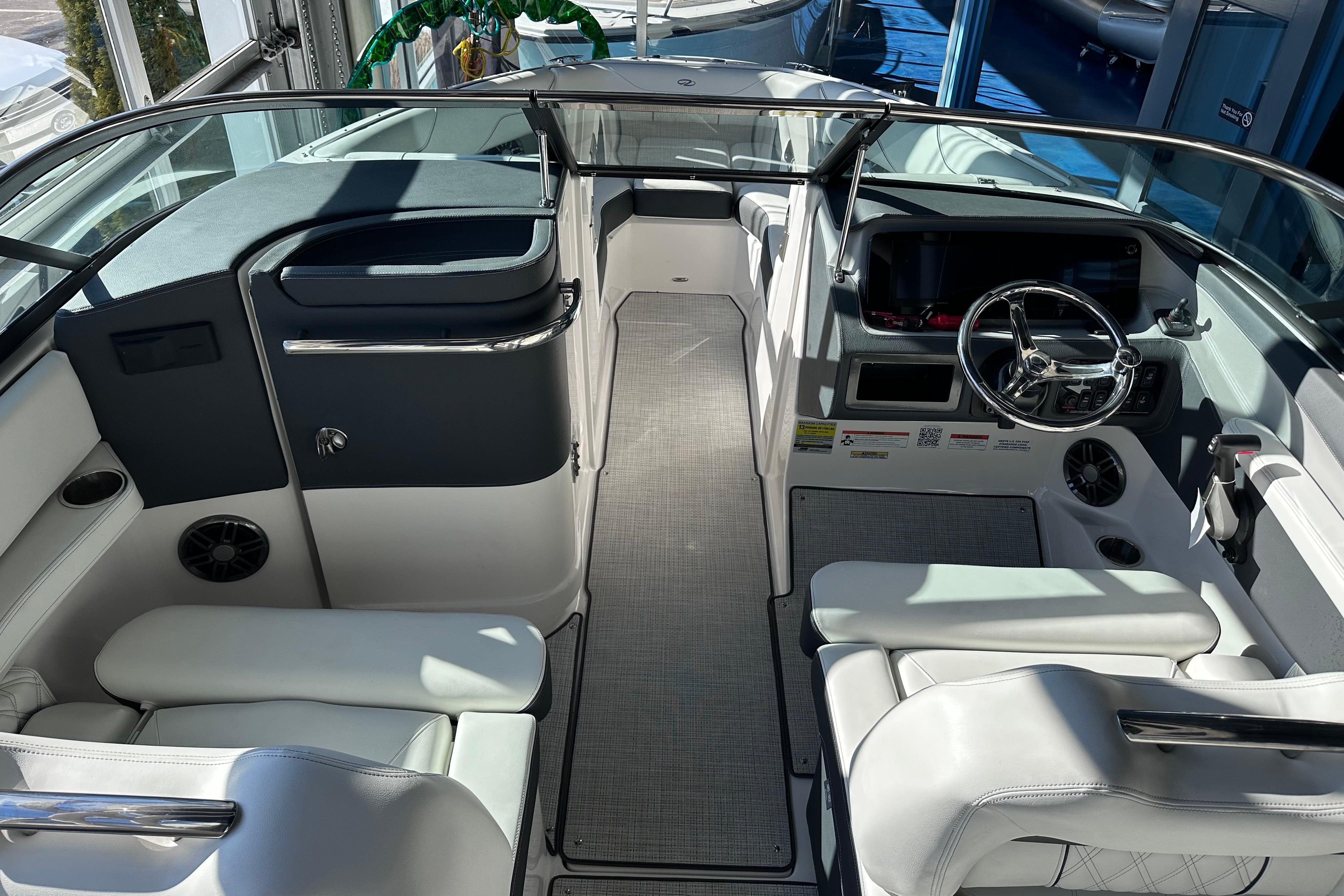 Interior of 2026 Regal LX4 boat with modern seating and steering wheel.
