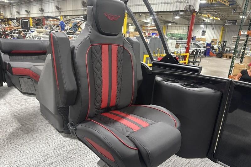 Luxurious seating on 2026 Bennington 24 MFBSF boat, featuring red and black upholstery.