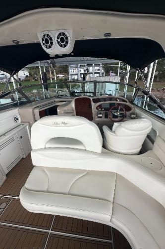 2004 Sea Ray 380 Sundancer yacht interior with white seating and modern dashboard.
