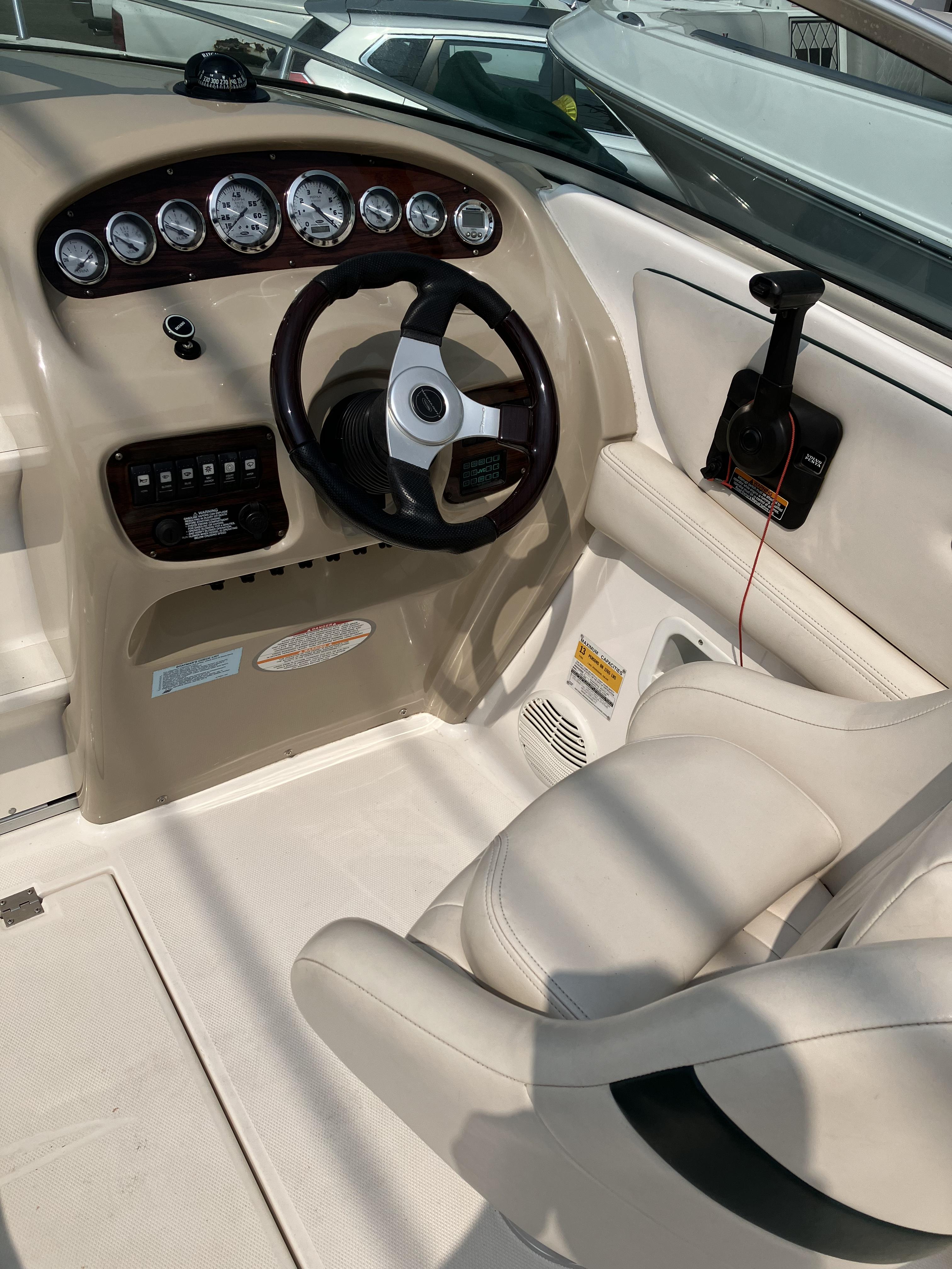 Helm of a 2001 Chaparral 235 SSi with cream seat and dashboard.