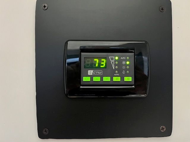 A control panel with a digital display shows the number 73.