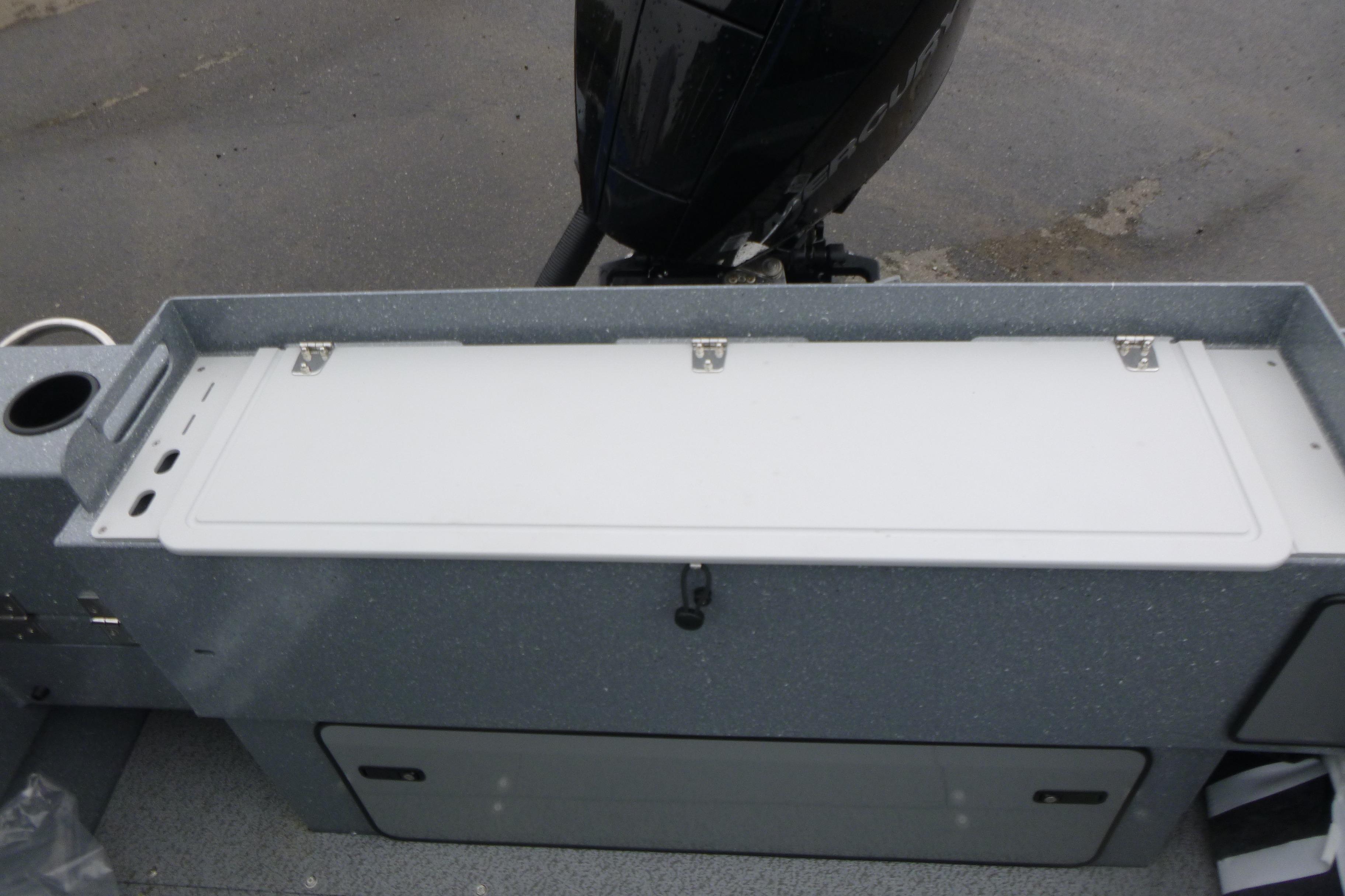 2026 KingFisher 2025 Escape boat with storage compartment and outboard motor.
