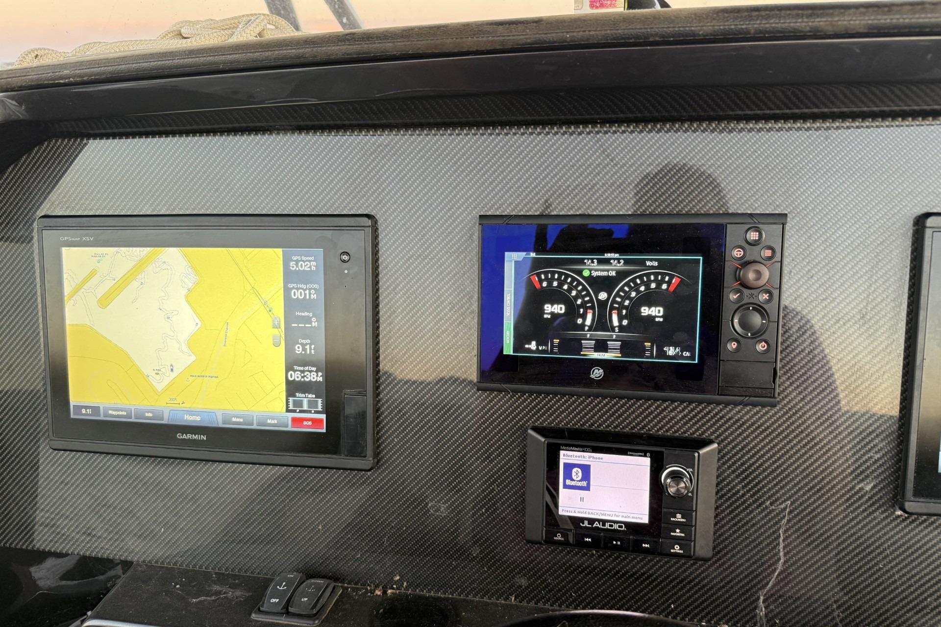 Dashboard of 2018 Nor-Tech 340 Sport Center Console with navigation and audio displays.