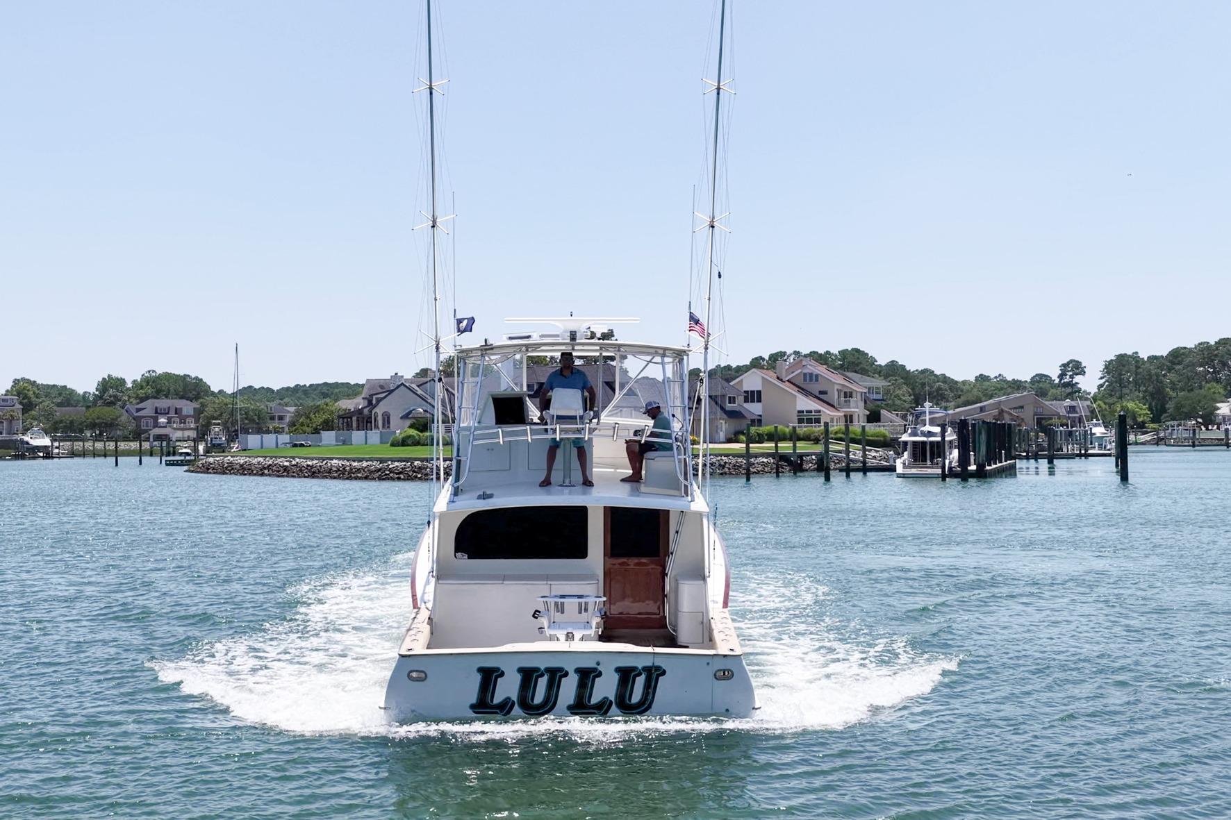 1998 Blackwell Custom Carolina Sportfish boat "Lulu" cruising in a marina.
