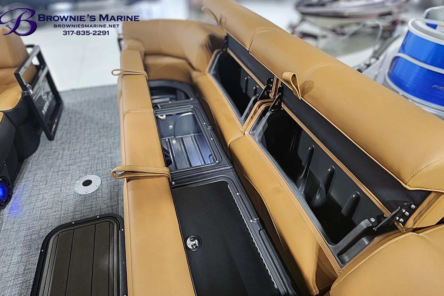 2026 Regency 250 DL boat interior with tan seating and storage compartments.