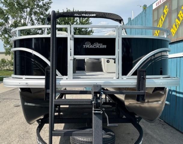 2026 Sun Tracker Fishin' Barge 20 DLX pontoon boat on trailer, rear view.