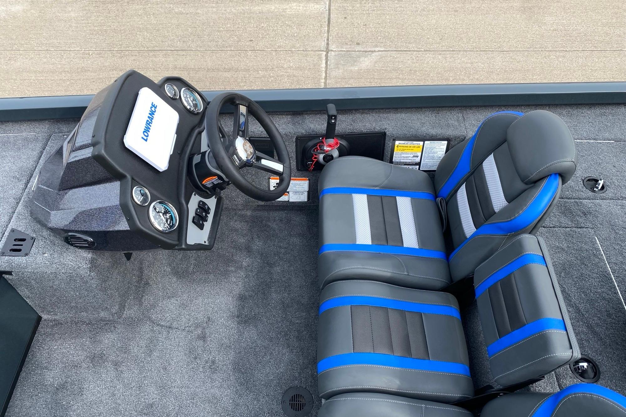 2026 Ranger RT188C boat interior with steering console and blue-accented seats.