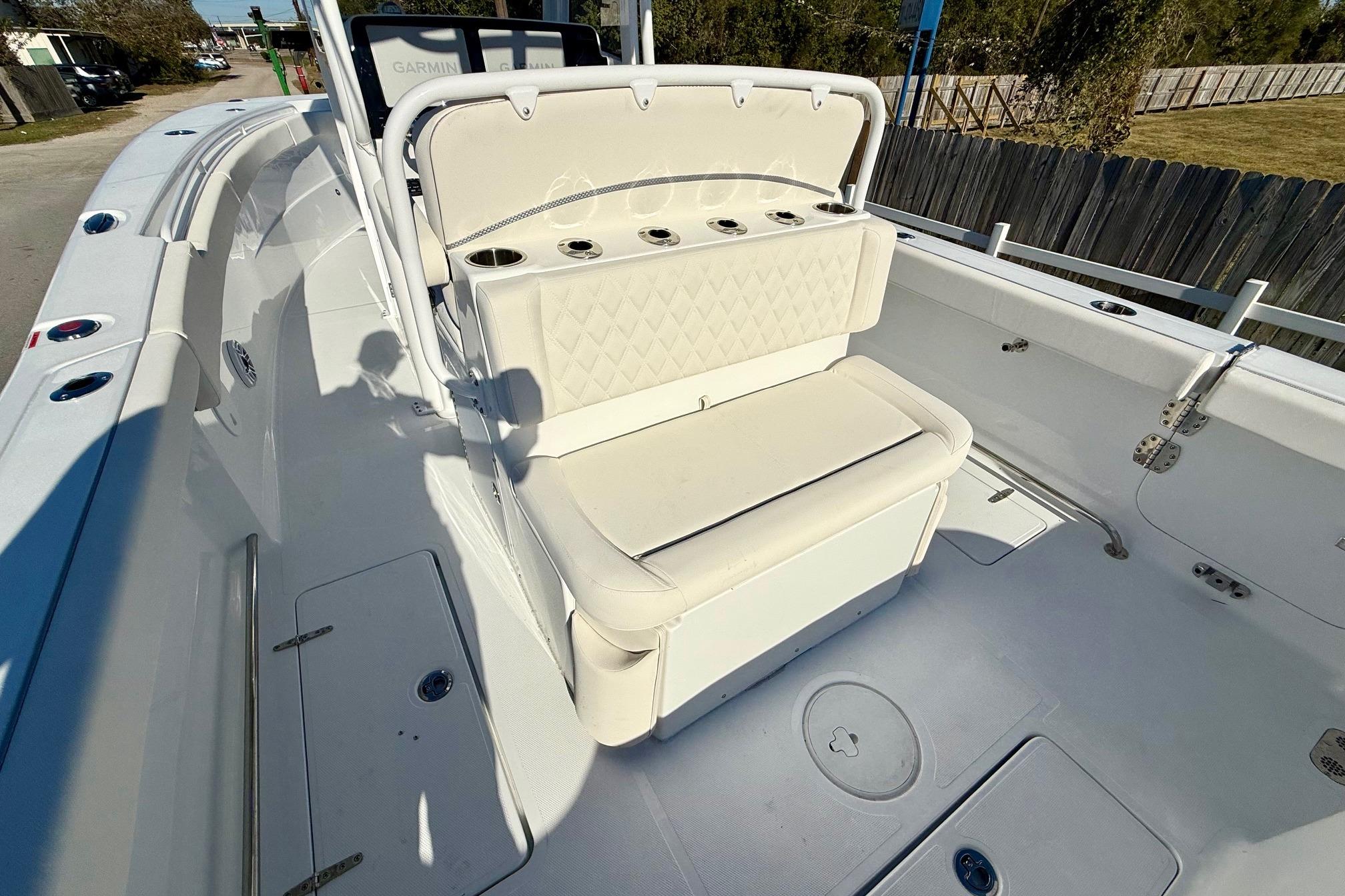 2026 Sea Hunt Ultra 275 Coffin Box boat interior with cushioned seating and storage.