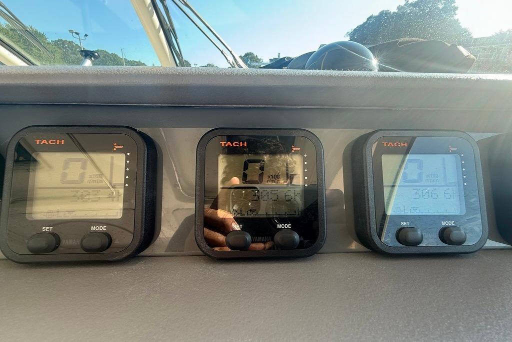 Close-up of tachometers on a 2010 Pursuit OS 375 Offshore boat dashboard.