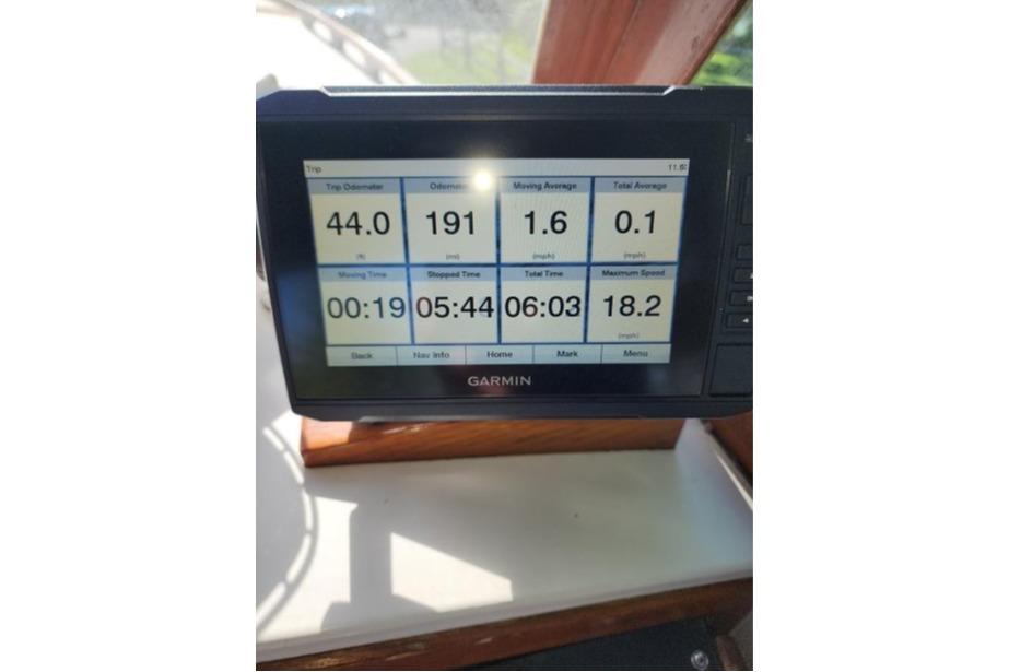 Garmin display on 1985 Wasque Down East Cruiser showing trip data and speed metrics.