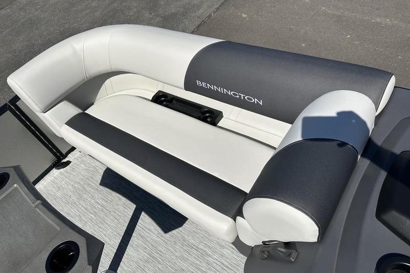 2026 Bennington 22 S Quad Bench boat seat, featuring sleek white and gray upholstery.
