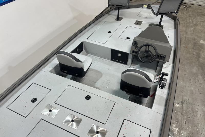 2026 SeaArk Flex 19 Pro boat interior with dual seats and steering console.